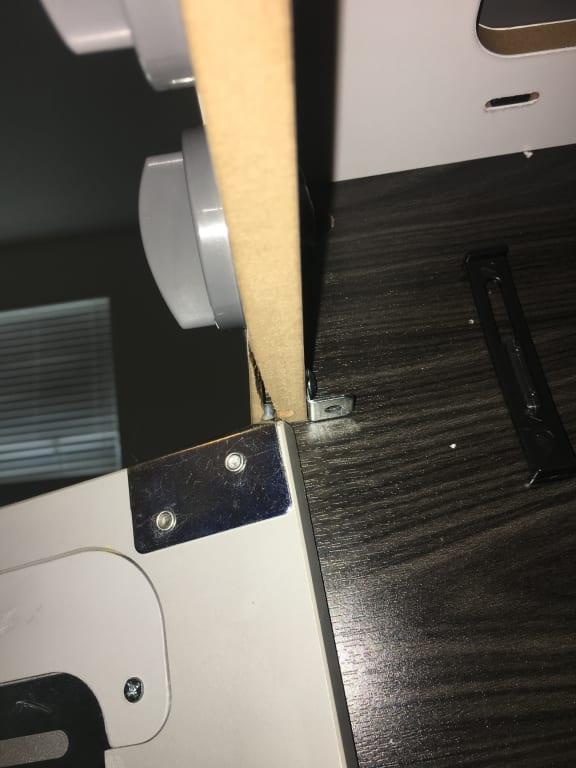 The oven door won't stay on now because this wood cracked.