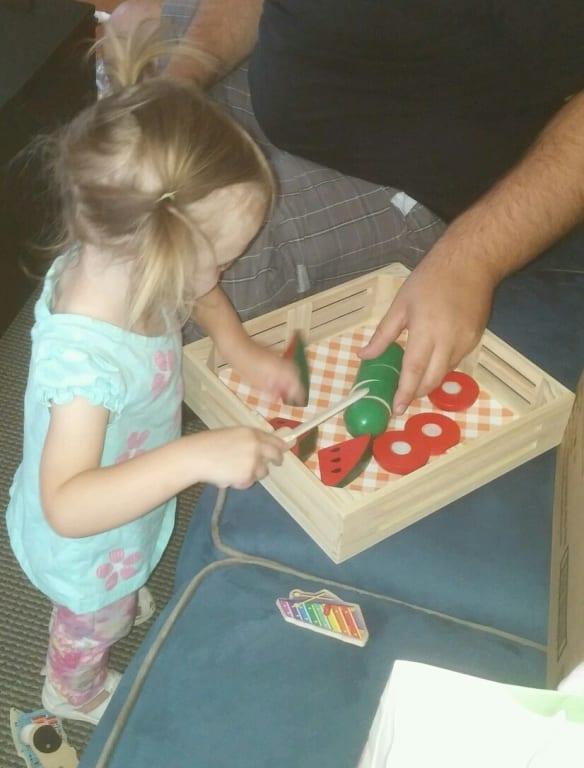 Zoe loves cutting her play food