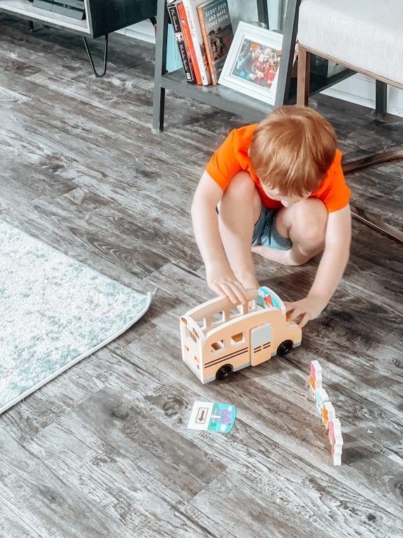 Playing with his bus!