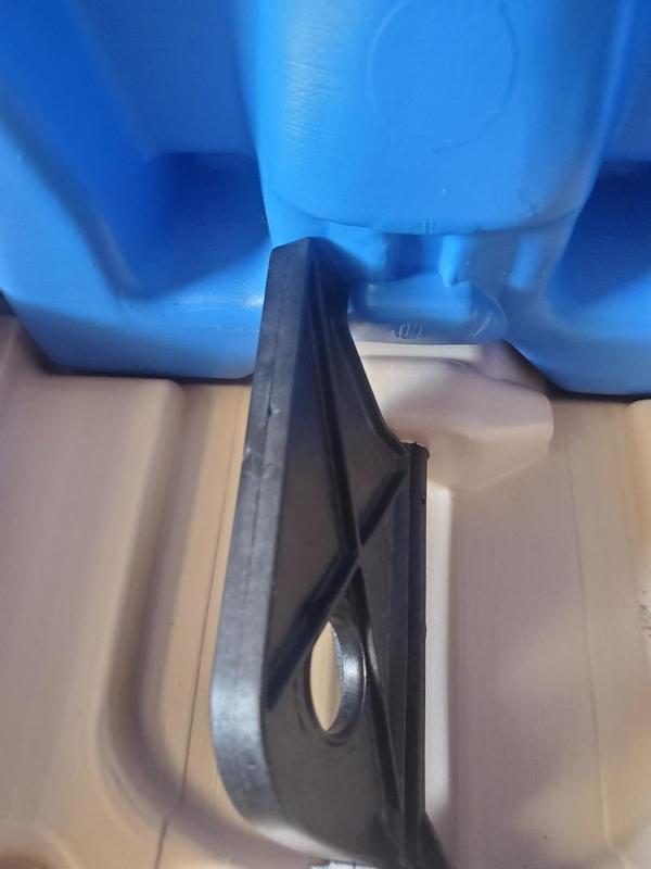 Picture of latches that won't fit over the plastic piece it's suppose to snap into.