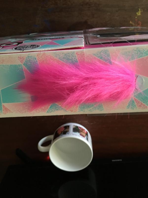 Cute fuzzy handle and carrying case.