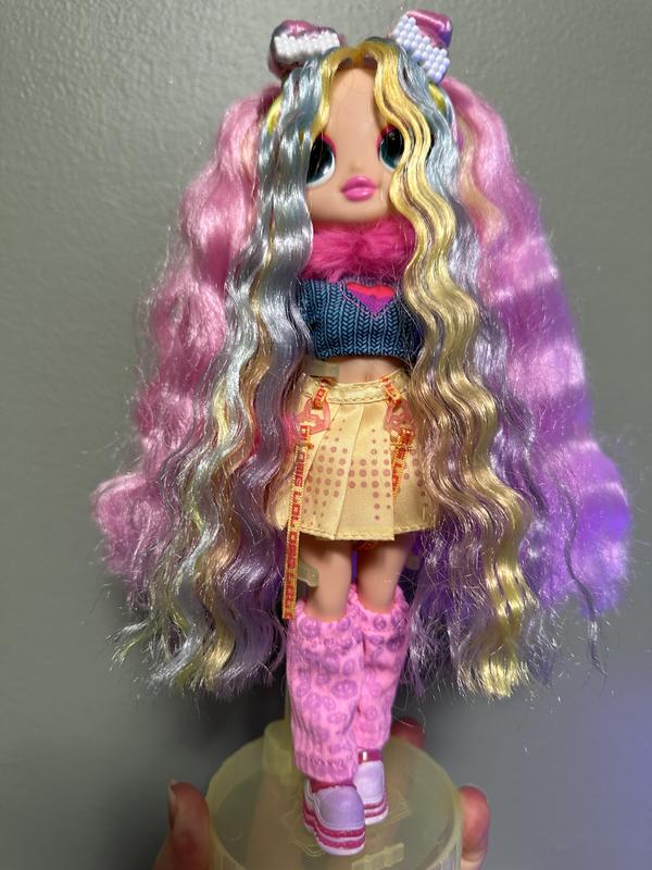 With black light (which is slightly reflecting on the side of her) but you can see the patterns show through and her hair gets much more subtle.