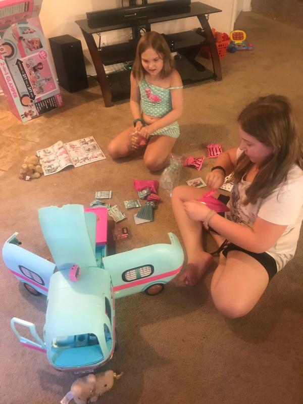 My girls unwrapping all the accessories