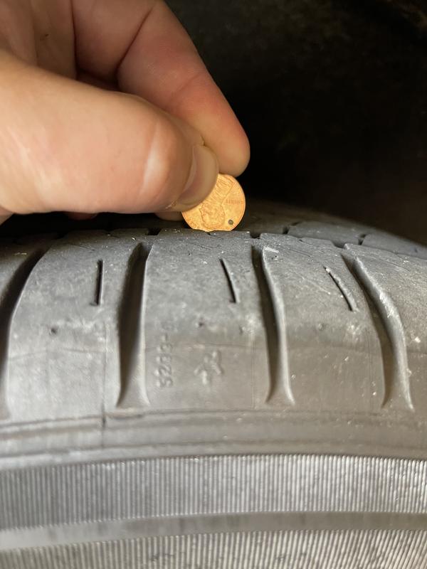 Penny test. Less then 2/32" remaining.