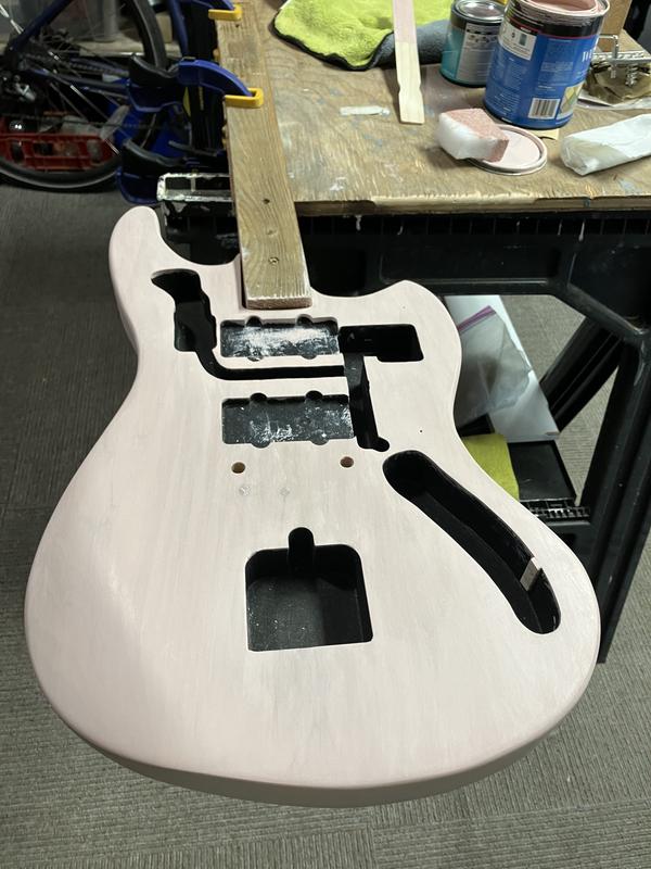 Four photos, bare wood, with pre stain, stain coat 1, stain coat 2..