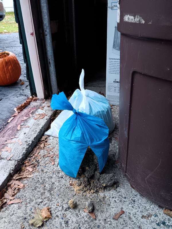 The one in the background is an example that you have to put then in a second garbage bag just to get them to the garbage can.