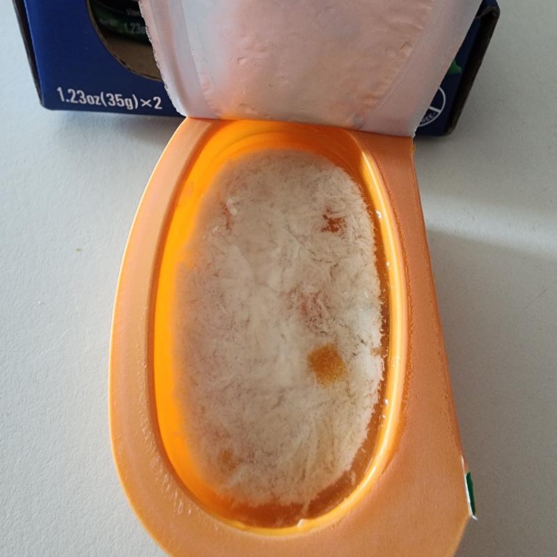 An opened package of the food displaying the pate.