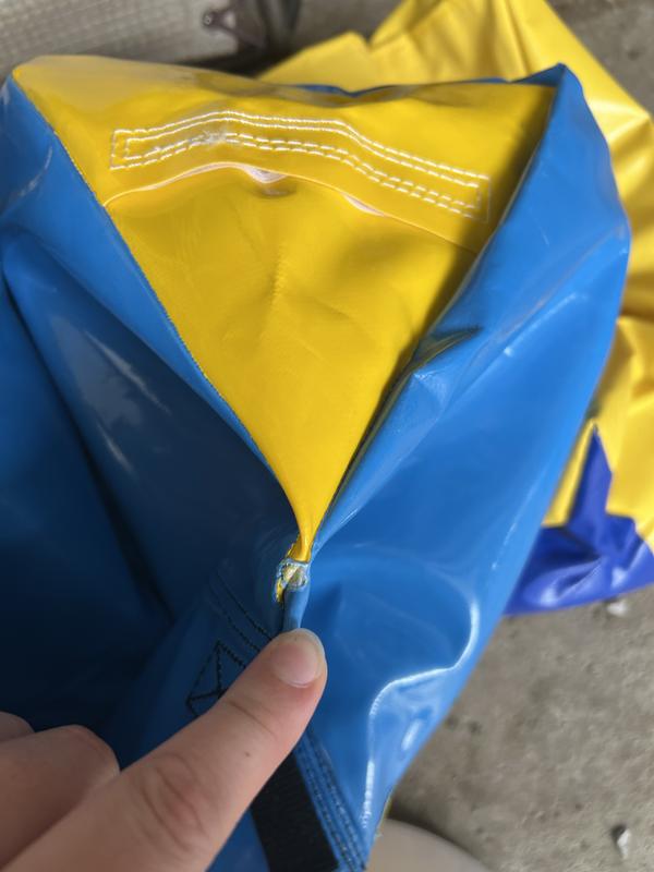 Photo of another rip in the bag and the very small hole you’re supposed to fill with