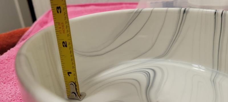 Closer to 2" than it is to 3"