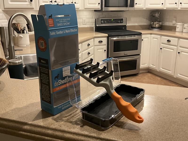 My boy, Benji, says he loves his new brush as he watches me put it away.