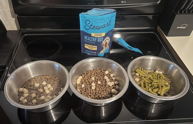 I did have a video of my dogs eating but it won’t let me add it, rest assured they all tore into their dinner with this topper on it!