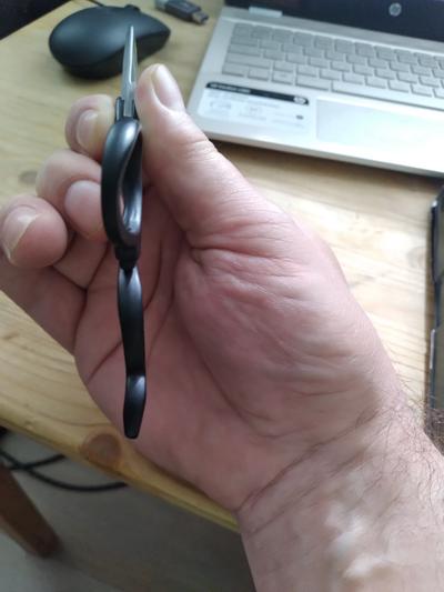 Note curvature of thumb hole skews left