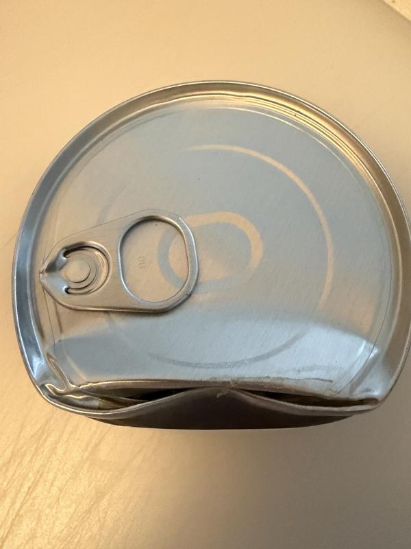 Closer view of damaged/open can