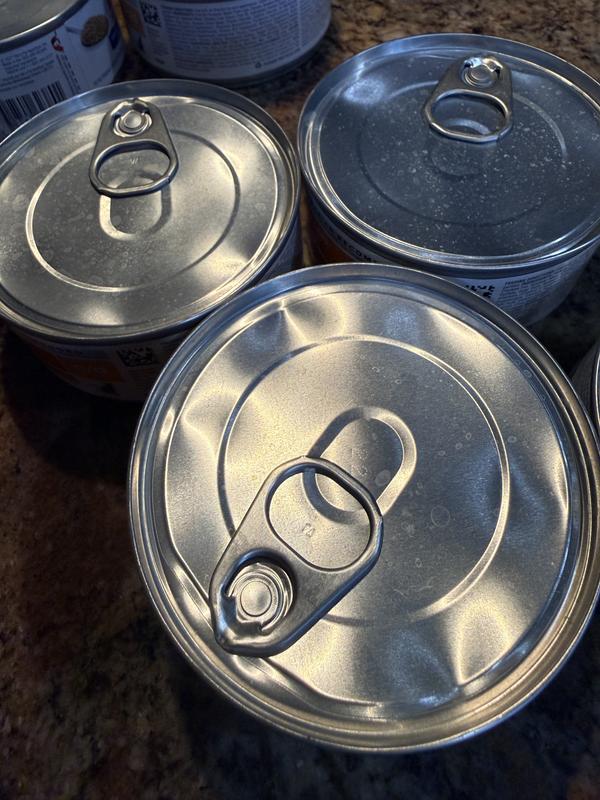 All top cans on 2 cases of 24 are damaged.