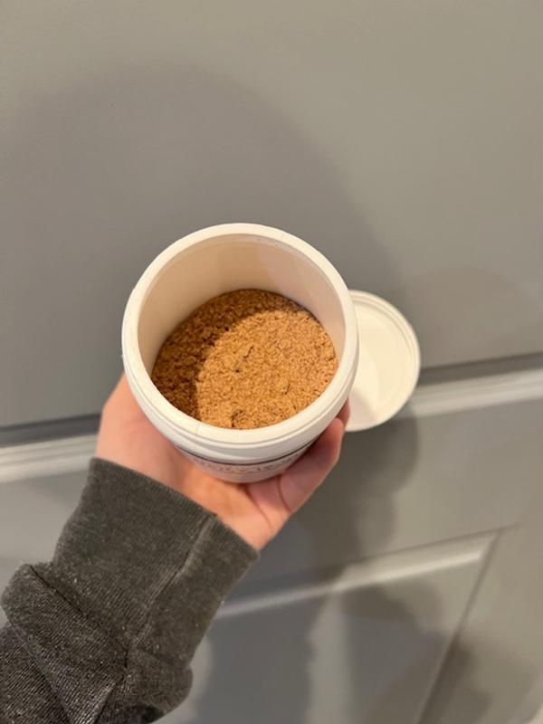 open and used jar of supplements