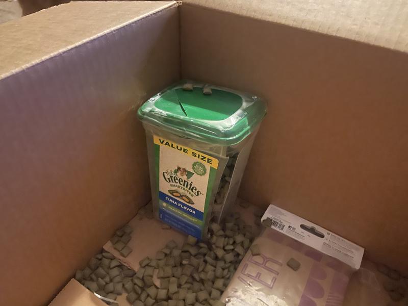 Broken with chunks of plastic.