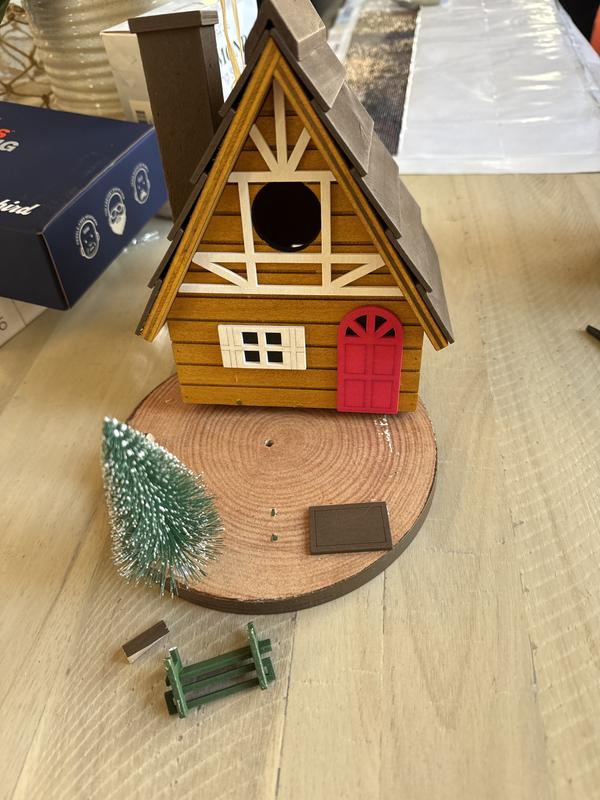 Broken. Hot glue strands everywhere