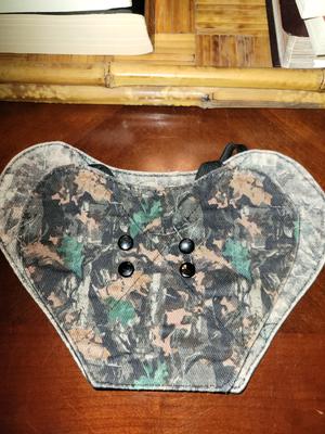 Original "medium" Chicken Chick" hen saddle a few years ago compared to the new one purchssed a few weeks ago. Barely fits my tiny Favorelle. Not as thick and snaps are plastic on outer saddle. Use to be metal.