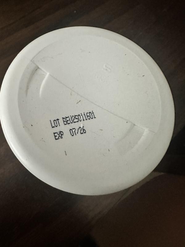 Bottom of the jar, showing the expiration date and lot number
