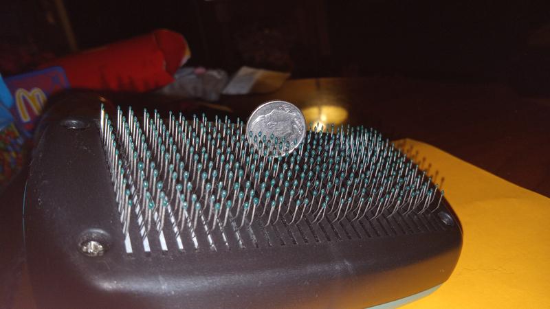 Bristle reach to around half the length of this dime.