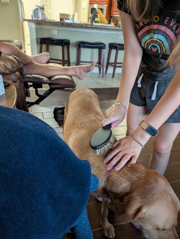 Standing perfectly still as if she's being massaged