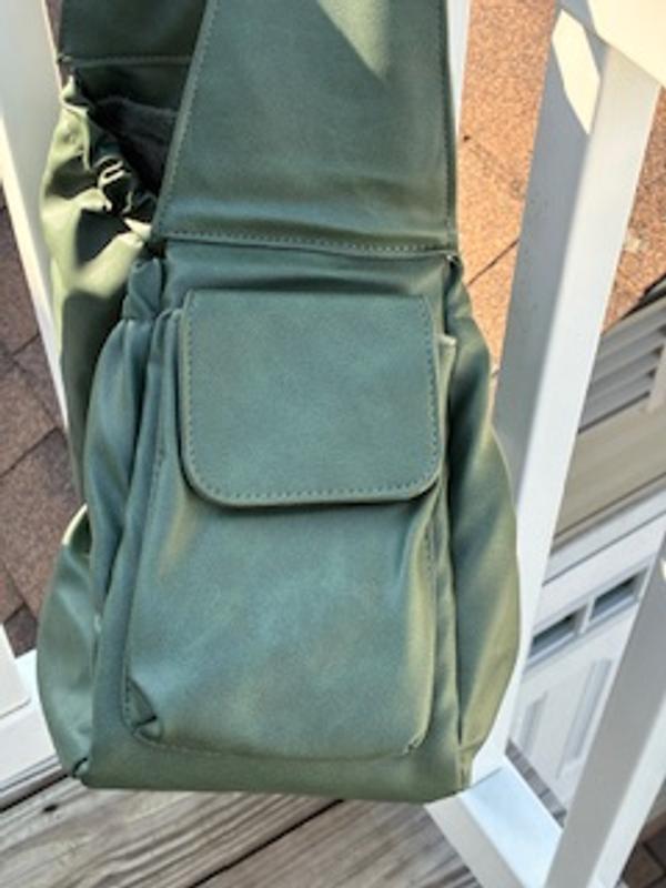 The other pocket.  Perfect for a cell phone or treats.  My pup would say treats, please!