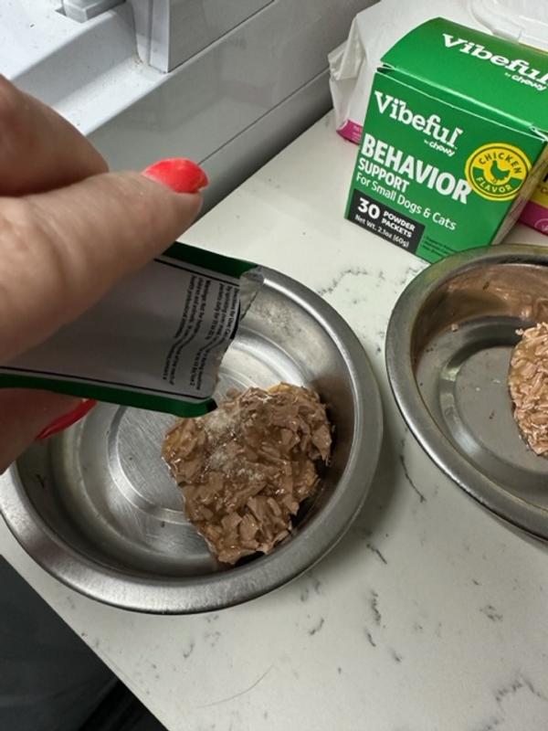 I sprinkle it onto their food and mix it in.