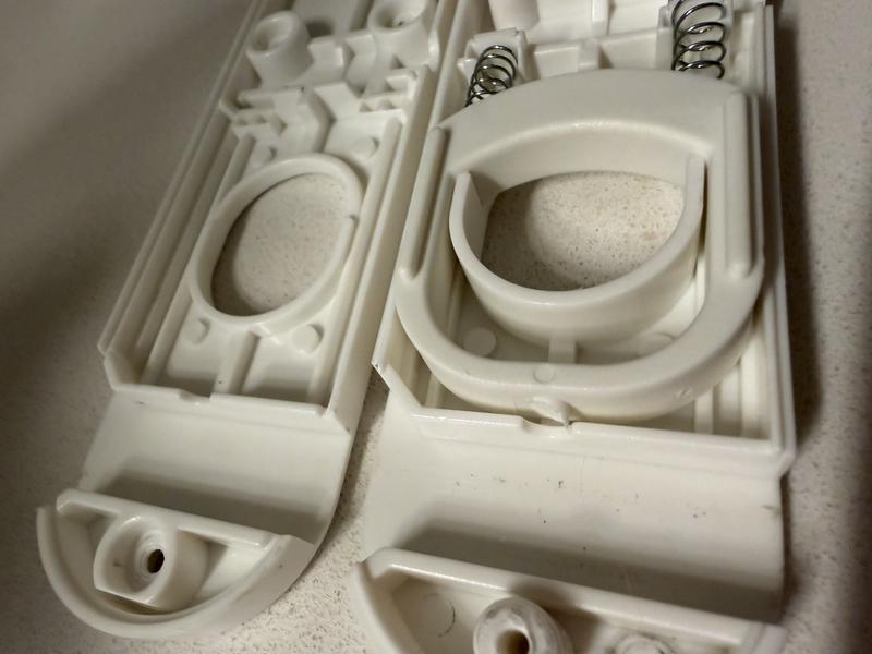 Manufacturing defect. Missing door locking pins. There should be a part sticking out to lock the door into three different positions