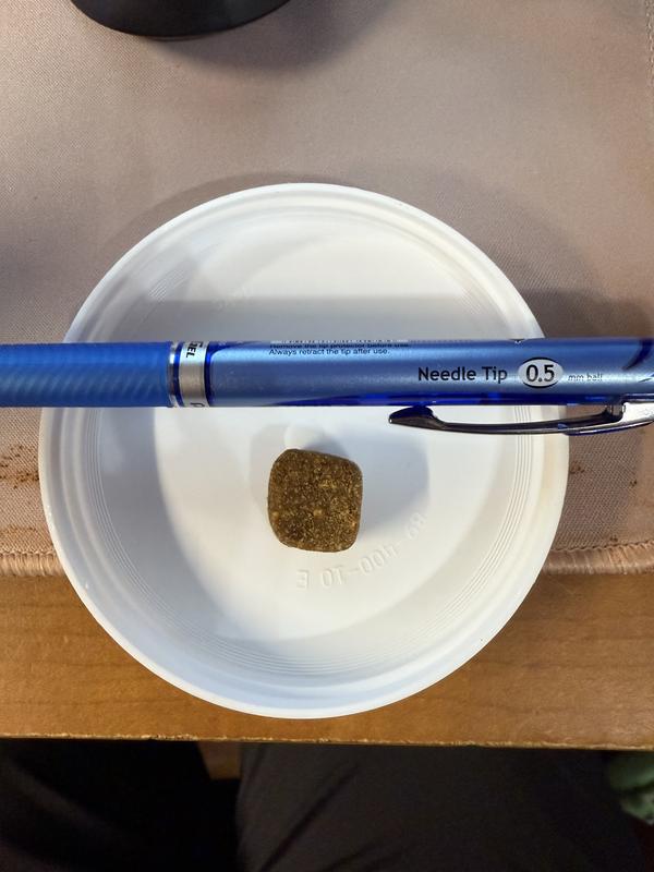 The pen is showing the size of the chews.