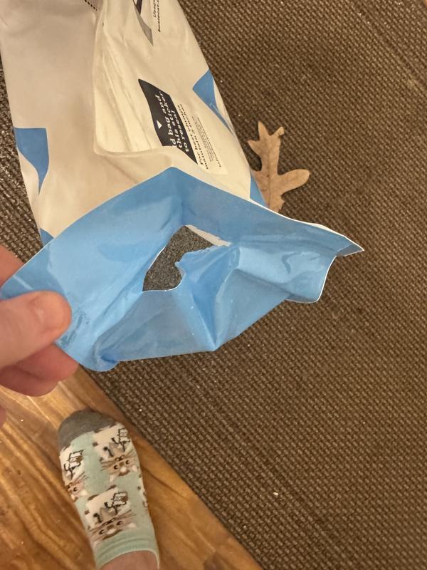 Split open on the side after opening