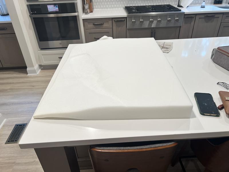 It is definitely not orthopedic and is incredibly thin!