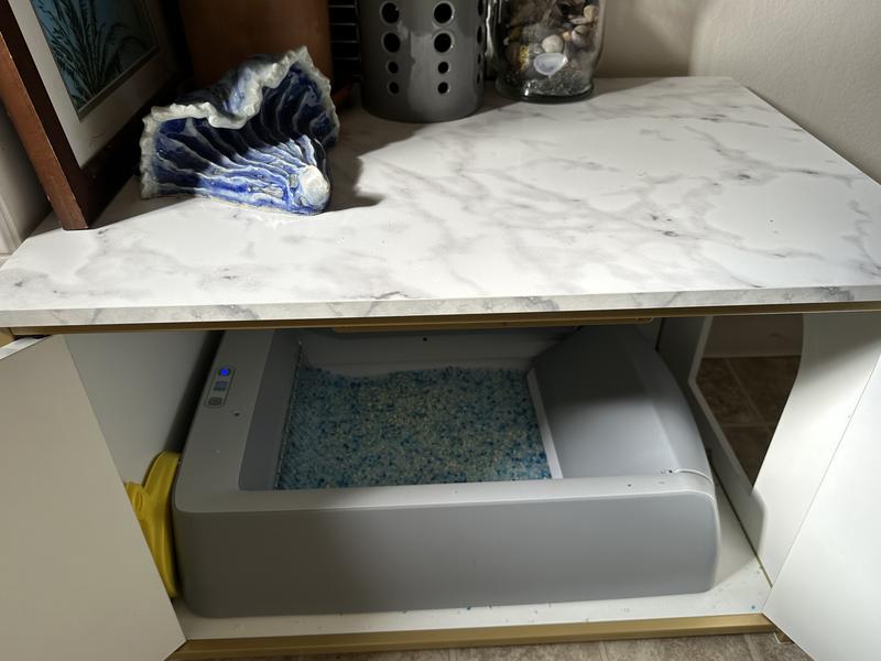 Work in the right size litter box enclosure.