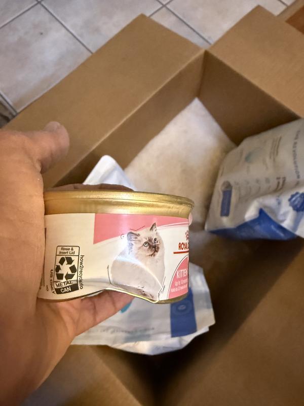 Cans arrived crushed by bags of cat litter.