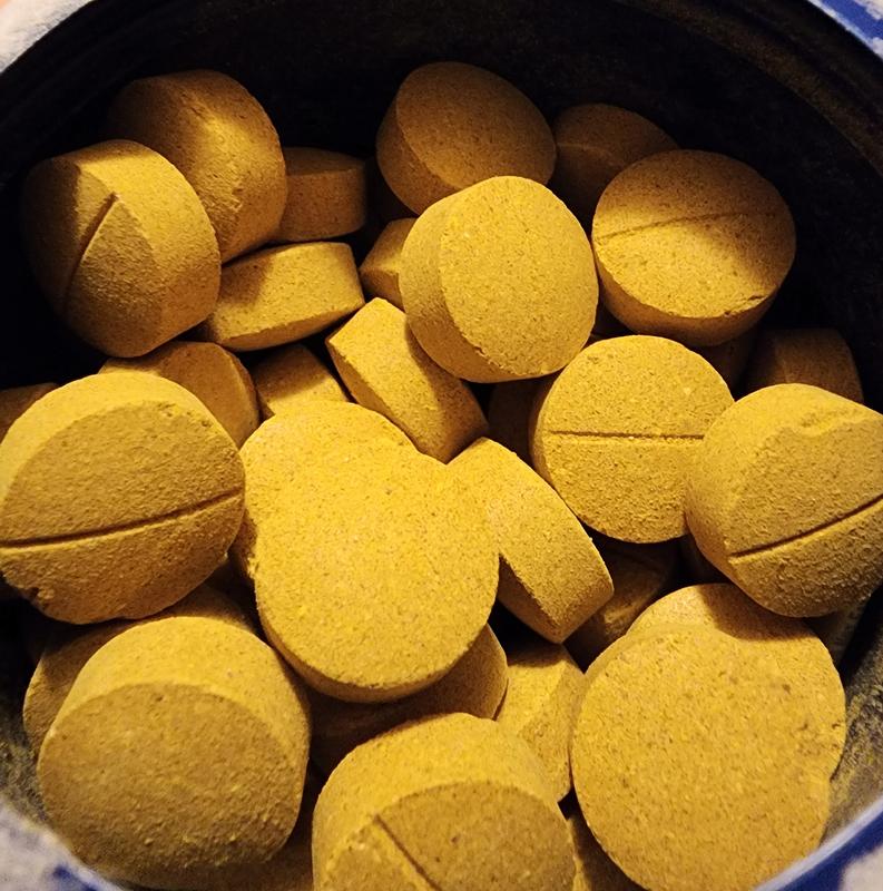 The vitamins inside the opened jar