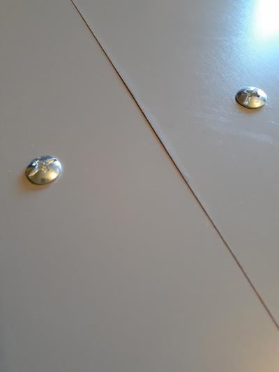 Domed screws that is no friend to a wood floor