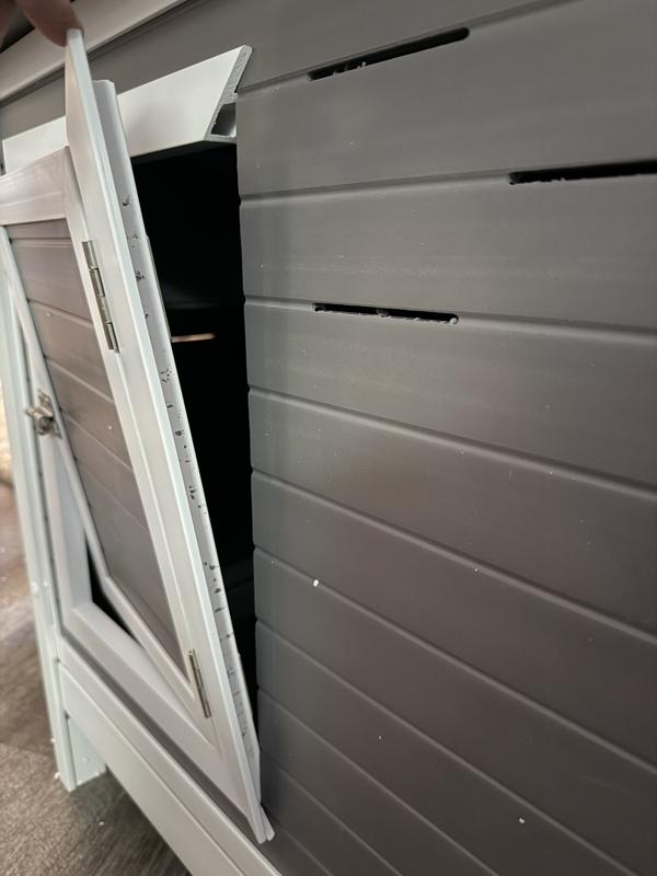 The door is falling off, nothing really holds the trim the hinges are on, in place.