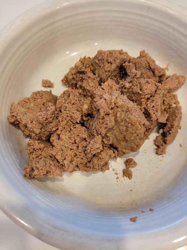 Firm, ground texture. Not watery or runny at all.