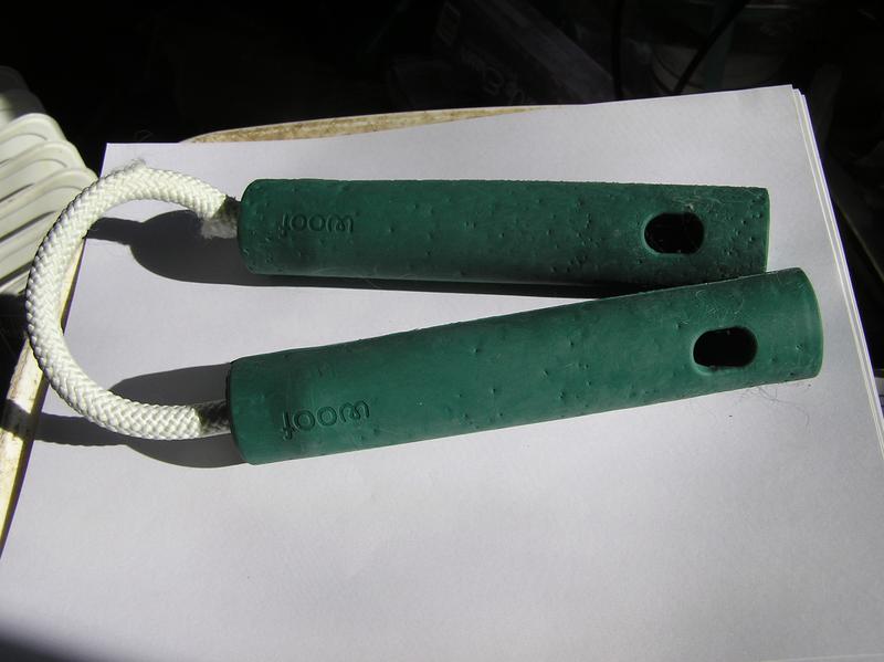 Nomchucks packaging, and nomchucks toy showing holes for food insertion