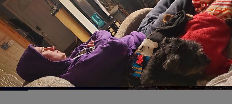 Sleeping next to her dad!