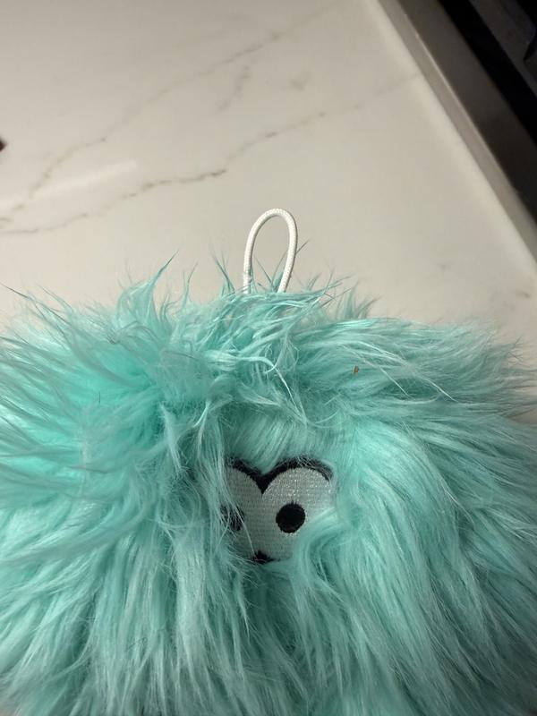 String on the top of the toy - I guess it's to hang in the store