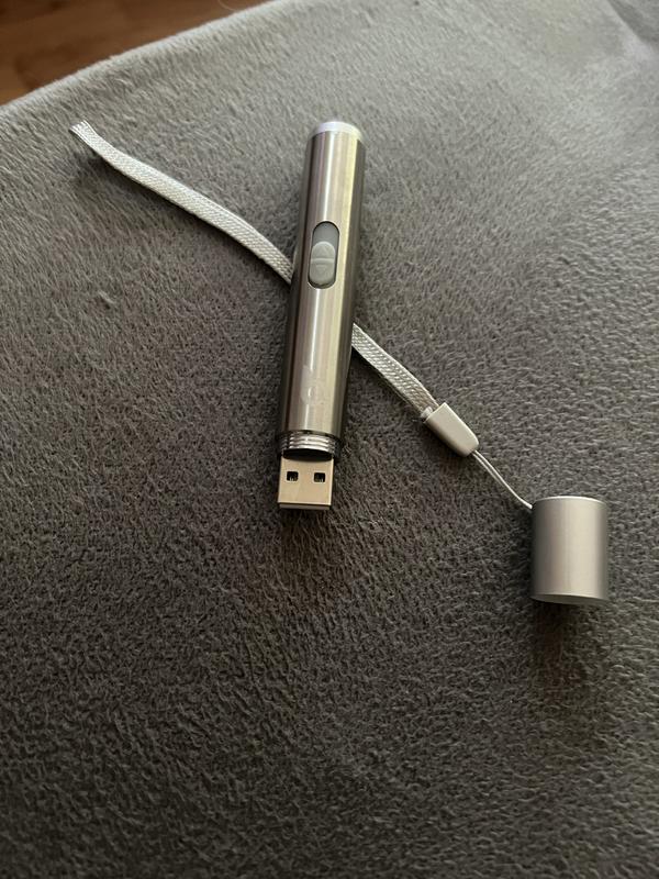 No cord included.  Can plug directly into laptop USB port or use a cord of your own.