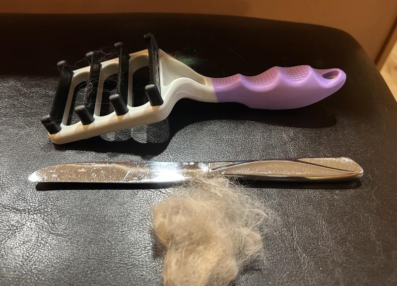 Size of Brush compared to an average kitchen knife and fur removed in 5 minutes of brushing.