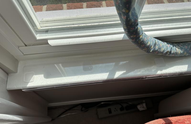 Transparent sill protector install.  (Windows sills deeper so we use a draft catcher to protect window caulking (which our dog already stuck her nails into after we repainted/caulked.