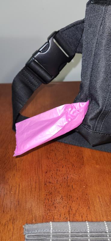 Little baggy holder with an opening to pull your bags out. Comes in handy and is a great design.