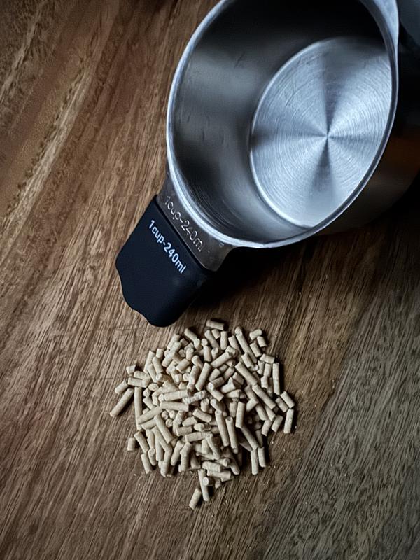 One small scoop per day added to normal feed... not even 1/8 of a cup.