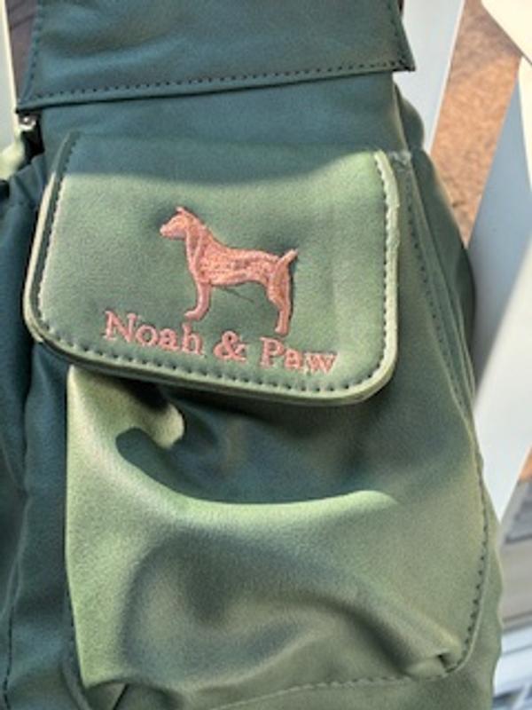 One of the side pockets, magnet closure.  Real embroidery!