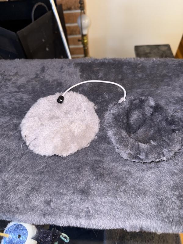 The dark piece is the outside. The lighter piece is what’s on the inside. They pulled it right off the string and it came apart.