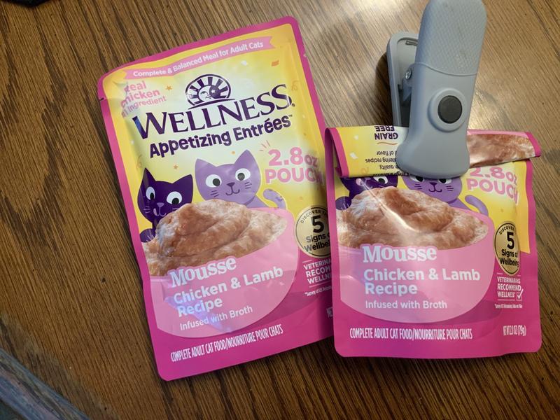 1st photo of Package, 2nd photo she enjoying her new treat! 3rd photo she is happy as can be. The fourth photo is what I mean about the pouches needing to be clipped.