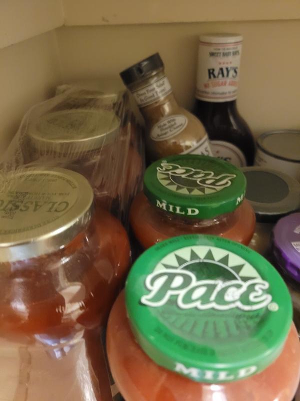 Dusty food containers in pantry