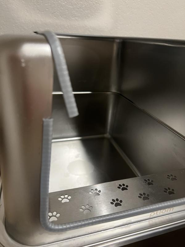 Trim is falling off, this is only one spot where it’s falling off. You can also see some staining in the pan.